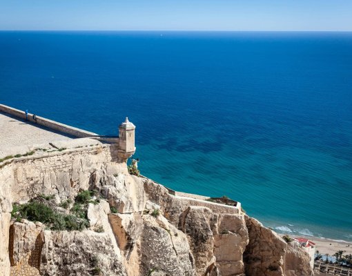 Explore the stunning coastal landscape from Santa Bárbara Castle in Alicante, Spain.