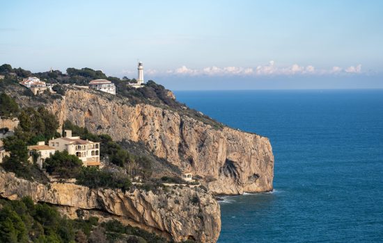 pexels photo 30616143 30616143 Scenic view of coastal cliffs with lighthouse in Jávea, Spain, perfect for travel inspiration.